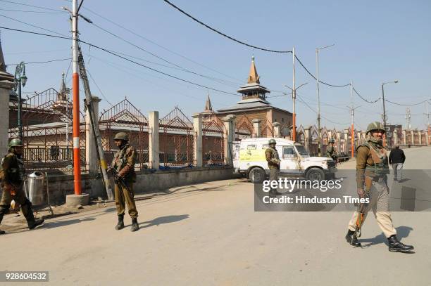 Paramilitary soldiers stand guard during restriction on March 7, 2018 in downtown area of Srinagar, India. Authorities today imposed restrictions in...