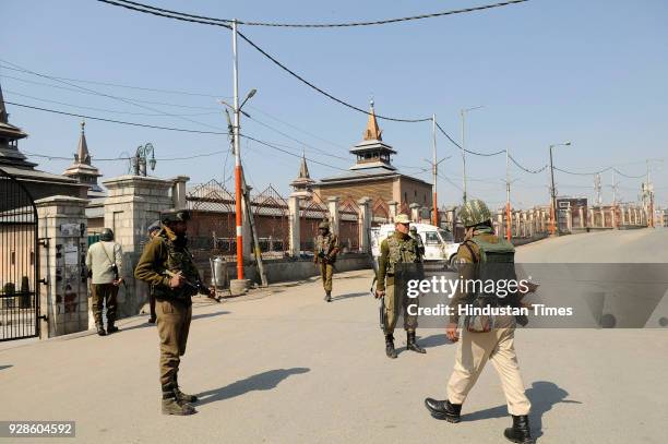 Paramilitary soldiers stand guard during restriction on March 7, 2018 in downtown area of Srinagar, India. Authorities today imposed restrictions in...