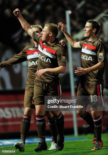 Rouwen Hennings celebrates after scoring his team's second gaol with team mate Max Kruse of St.Pauli during the Second Bundesliga match between FC...