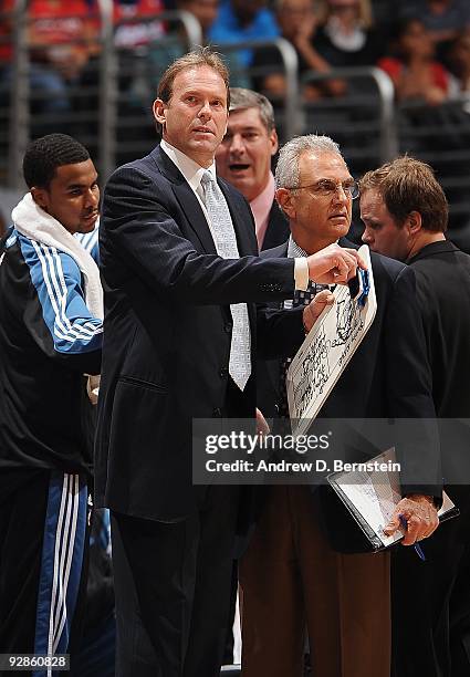 Head coach Kurt Rambis, assistant coach Bill Laimbeer and assistant coach Dave Wohl of the Minnesota Timberwolves stand on the sideline during the...