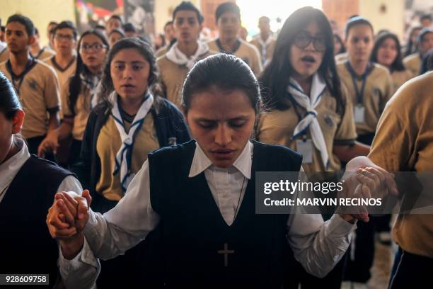 Catholic faithfuls attend a mass to celebrate the announcement that Pope Francis signed decrees allowing the canonization of Pope Paul VI and...