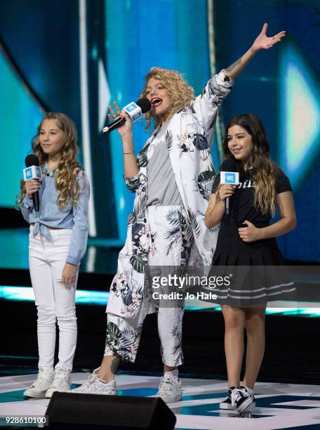 Rosie McClelland, Becca Dudley and Sophie Grace on stage at We Day UK at Wembley Arena on March 7, 2018 in London, England.