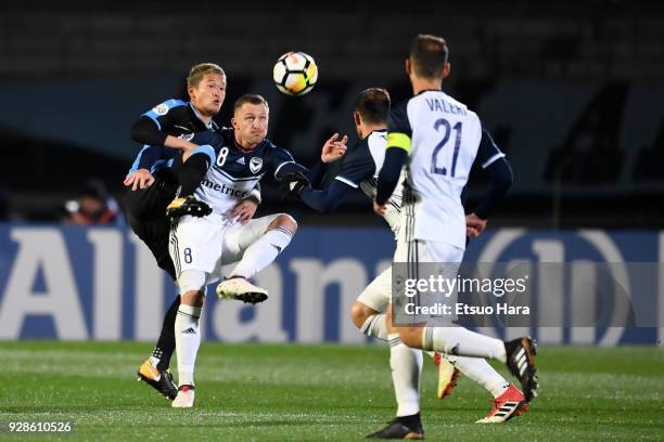 Besart Berisha of Melbourne Victory and Tatsuki Nara of Kawasaki Frontale compete for the ball during the AFC Champions League Group F match between...