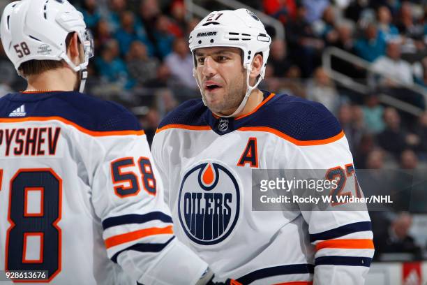 Milan Lucic and Anton Slepyshev of the Edmonton Oilers talk during the game against the San Jose Sharks at SAP Center on February 27, 2018 in San...