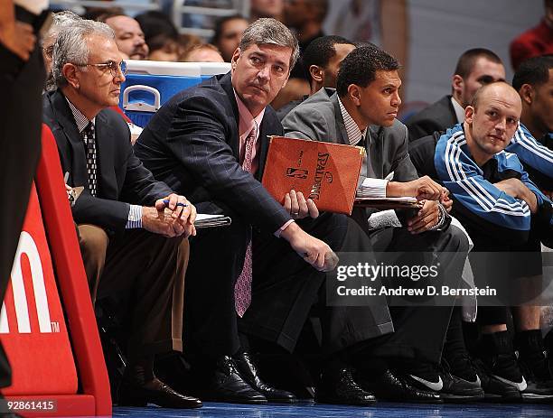 Assistant coaches Dave Wohl, Bill Laimbeer and Reggie Theus of the Minnesota Timberwolves sit on the bench during the game against the Los Angeles...