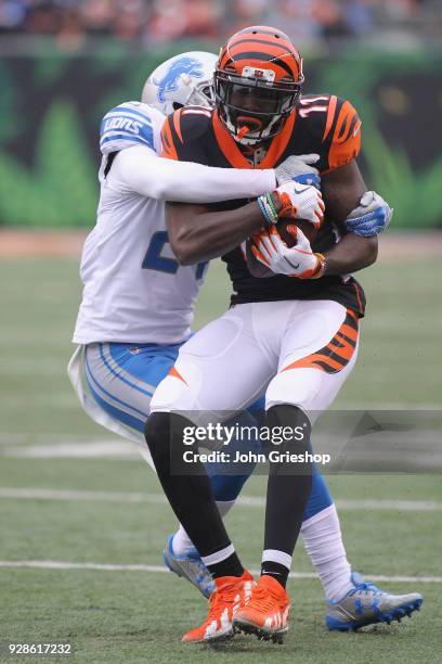 Brandon LaFell of the Cincinnati Bengals runs the football upfield against Nevin Lawson of the Detroit Lions during their game at Paul Brown Stadium...