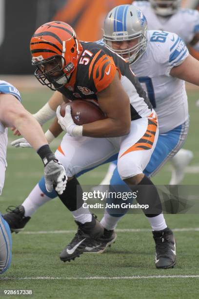 Vincent Rey of the Cincinnati Bengals runs the football upfield against Graham Glasgow of the Detroit Lions during their game at Paul Brown Stadium...