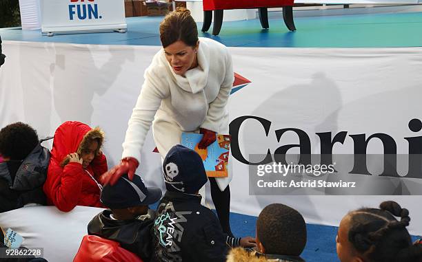 Actress Marcia Gay Harden greets children before reading from The Big Book of Dreams in Rockefeller Center on November 6, 2009 in New York City.
