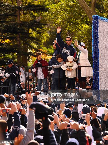 Jorge Posada of the New York Yankees, his wife Laura Posada , their son Jorge Posada III , and daughter Paulina Posada celebrate on a float during...