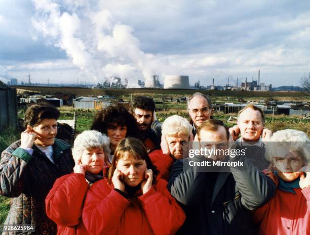 Residents of Lazanby cover their ears as the noise from the Enron site becomes unbearable, 17th February 1993.