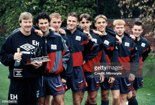Manchester United youth team coach Eric Harrison is awarded a bottle of champagne and and special trophy by Premier League sponspors Carling for his...