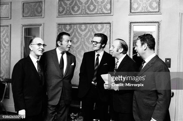 Billy Marsh, Bernard Delfont, Michael Grade, Leslie Grade and Dennis van Thal attend a reception at Cafe Royal to celebrate EMI selling their London...