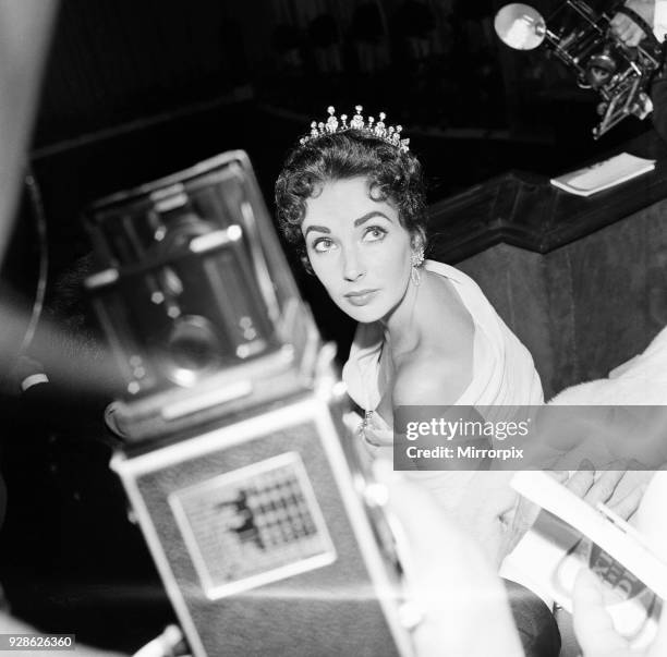 Elizabeth Taylor pictured on opening night of the Cannes Film Festival 1957, where her husband and film producer Mike Todd, is promoting new film...