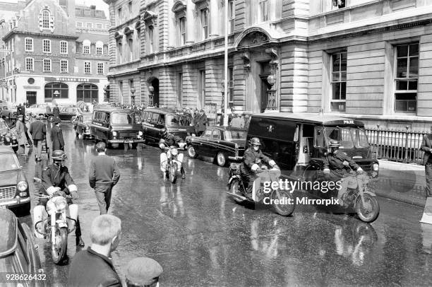 General scenes of the police escorting the Krays and other prisoners who were remanded in custody, to Bow Street Magistrates Court, London, 10th May...
