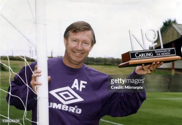 Manchester United manager Alex Ferguson holding his Carling Manager of the Month Award. Circa September 1993.