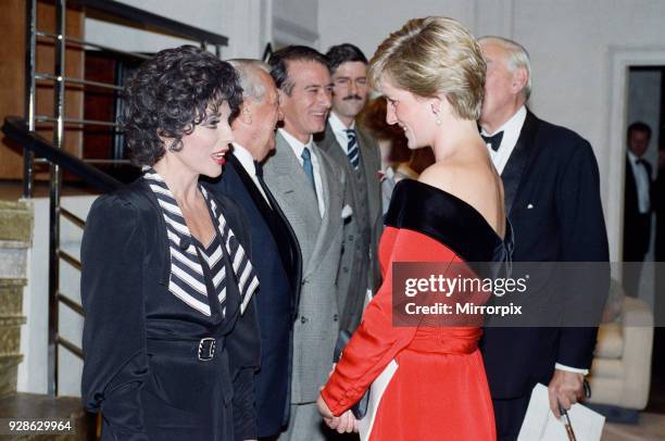 Princess Diana with actress Joan Collins after a charity performance of the play Private Lives at the Aldwych Theatre in London. The Princess wears a...