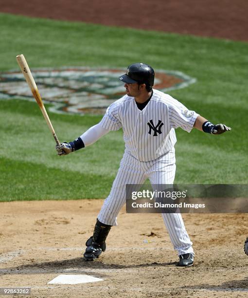 Outfielder Nick Swisher of the New York Yankees stands in the batter's box and awaits the next pitch during a game on April 19, 2009 against the...