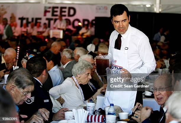 Ron Livingston waits on World War II Veterans during the Feed The Troops event at the National World War II Museum as part of the expansion grand...