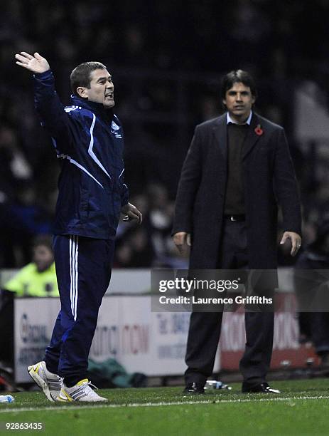 Manager Nigel Clough of Derby gestures to his players in front of Coventry manager Chris Coleman during the Coca-Cola Championship match between...