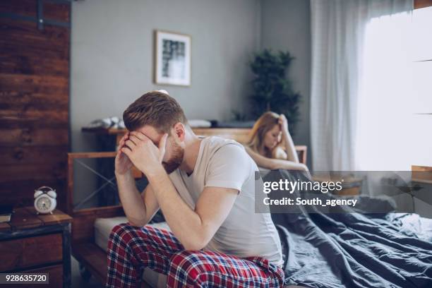 couple having problems in bed - husband stock pictures, royalty-free photos & images