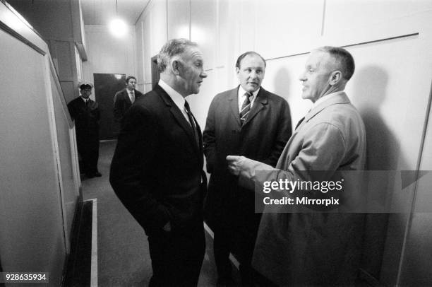 Liverpool manager Bill Shankly chats to Spurs manager Bill Nicholson and Harry Potts, general manager of Burnley, after watching a match in the...