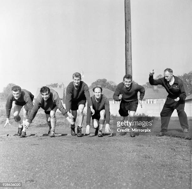 Liverpool Football Club team training at Melwood Drive, West Derby. Manager Bill Shankly starts five of his team off in a 100 yard sprint. Left to...