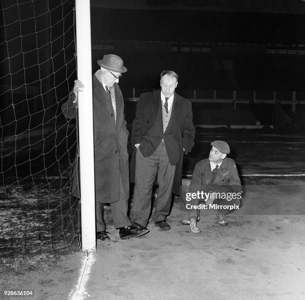 Liverpool manager Bill Shankly inspecting the Anfield pitch with chairman T V Williams and head groundsman Arthur Riley after referee George McCabe...