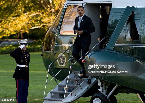 President Barack Obama disembarks from Marine One at the White House in Washington on November 6, 2009 after returning from a visit to the Walter...