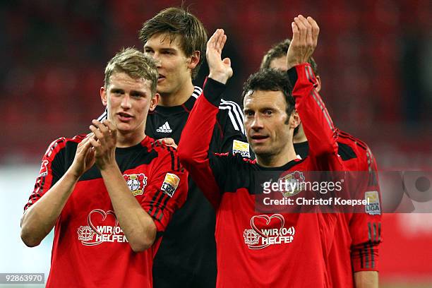Lars Bender, Fabian Giefer and Thomas Zdebel of Leverkusen celebrate the 4-0 victory after the Bundesliga match between Bayer Leverkusen and...