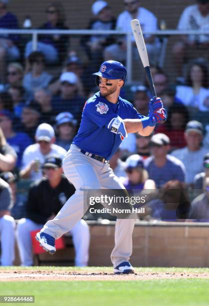 Tommy La Stella of the Chicago Cubs gets ready in the batters box during a spring training game against the Colorado Rockies at Salt River Fields at...