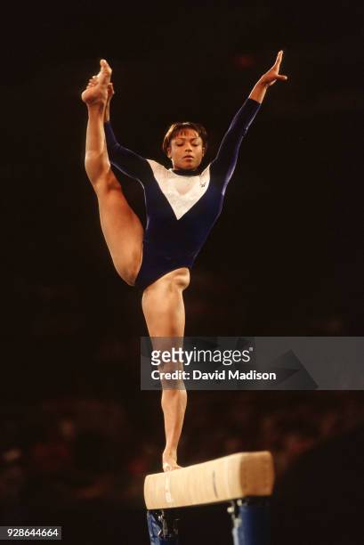 Dominique Dawes of the United States competes on the balance beam during the Gymnastics competition of the Goodwill Games which took place from July...