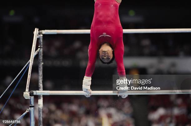 Dominique Dawes of the United States competes on the uneven bars during the Women's Gymnastics event of the Olympic Games on September 16, 2000 in...