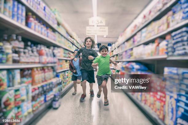 racing in the grocery store - unconventional imagens e fotografias de stock