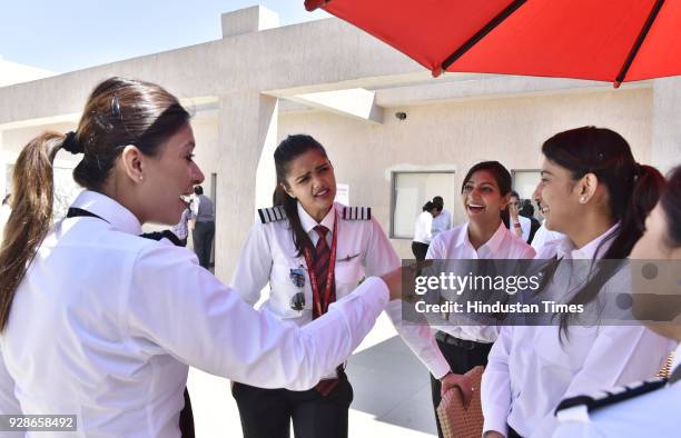 Newly recruited women pilots share a light moments with each other on the eve of Women's Day at SpiceJet Training Academy Udyog Vihar Phase on March...