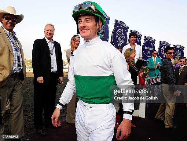 Jockey Julien Leparoux smiles as he leaves the winner's circle after winning the Breeders' Cup Juvenile Filly and Mare Sprint race with Informed...