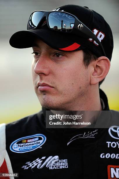 Kyle Busch, driver of the Z-Line Designs/WWE Smackdown Toyota, stands on pit road during qualifying for the NASCAR Nationwide Series O'Reilly...