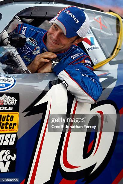 Matt Kenseth, driver of the CitiFinancial Ford, sits in his car during qualifying for the NASCAR Nationwide Series O'Reilly Challenge at Texas Motor...