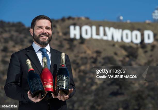 Piper Heidsieck Global Executive Director Benoit Collard poses for portraits in front of the Hollywood Sign with the limited editions of the Oscars...