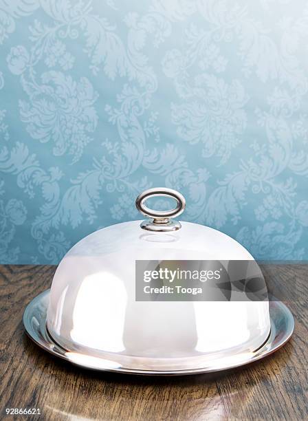 silver coved serving dish on dining table - serving dish stock pictures, royalty-free photos & images