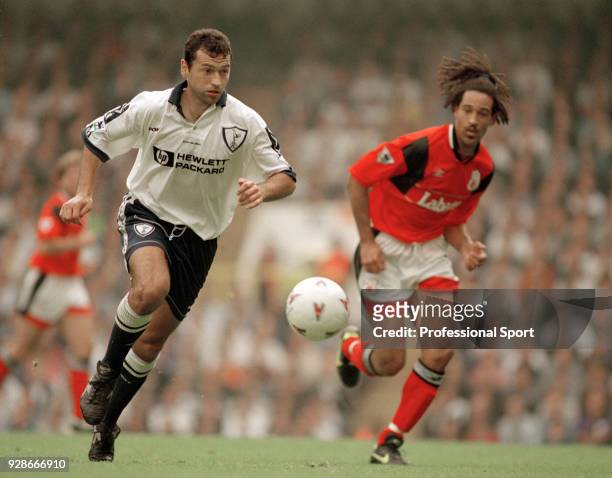 Colin Calderwood of Tottenham Hotspur is chased by Jason Lee of Nottingham Forest during an FA Carling Premiership match at White Hart Lane on April...