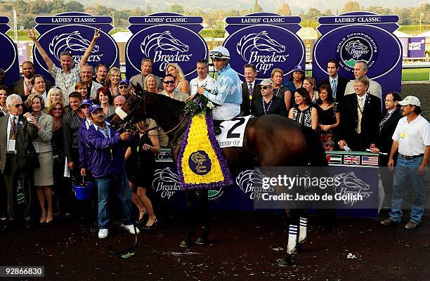 Jockey Garrett Gomez celebrates in the winner's circle after winning the Breeders' Cup Ladies Classic race with Life Is Sweet during the Breeders'...