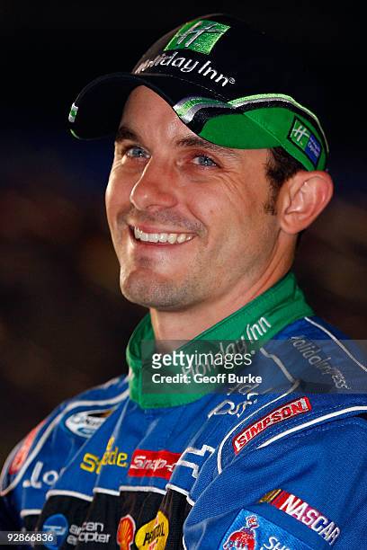 Casey Mears, driver of the Holiday Inn/Holiday Inn Express Chevrolet, stands on pit road during qualifying for the NASCAR Nationwide Series O'Reilly...