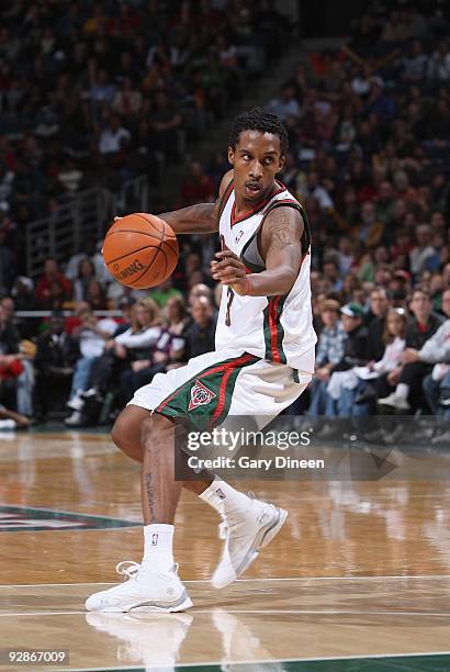 Brandon Jennings of the Milwaukee Bucks moves the ball against the Detroit Pistons during the game on October 31, 2009 at the Bradley Center in...