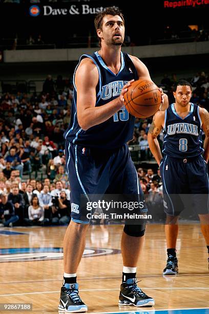 Mehmet Okur of the Utah Jazz shoots a free throw during the game against the Dallas Mavericks on November 3, 2009 at American Airlines Center in...