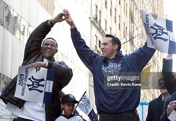 Yankee pitcher, CC Sabathia and Yankee first baseman, Mark Teixeira celebrate duing the 2009 New York Yankees World Series Victory Parade on November...