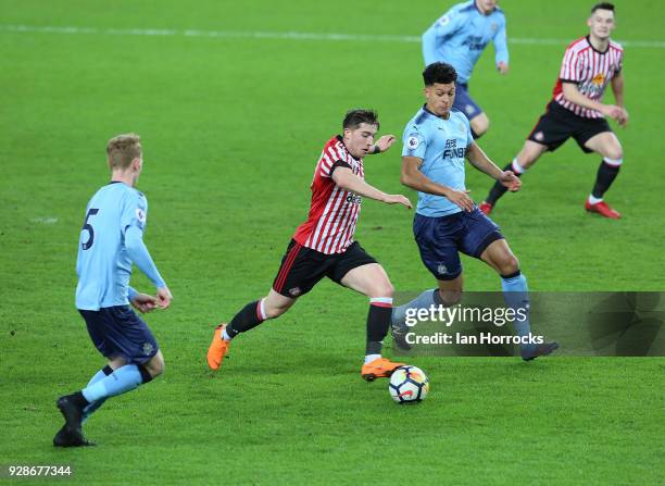 Joseph Yarney of Newcastle and team-mate Michael Newbury chase down Lynden Gooch of Sunderland during the Premier League International Cup match...