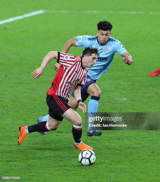 Joseph Yarney of Newcastle chases down Lynden Gooch of Sunderland during the Premier League International Cup match between Sunderland U23 and...