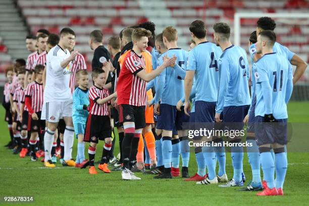 Squads shake hands at the start of the Premier League International Cup match between Sunderland U23 and Newcastle United U23 at Stadium of Light on...