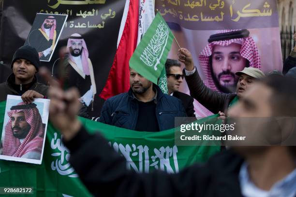 On the first day of his official 3-day visit to London, supporters of Saudi Crown Prince Mohammed bin Salman celebrate in Whitehall before bin...