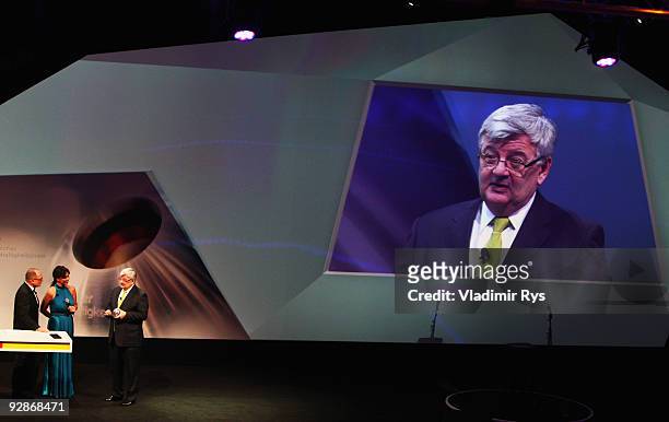 Former German foreign minister Joschka Fischer receives his award during the German Sustainability Award 2009 prize giving ceremony on November 6,...